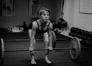 Woman Barbell Deadlifting